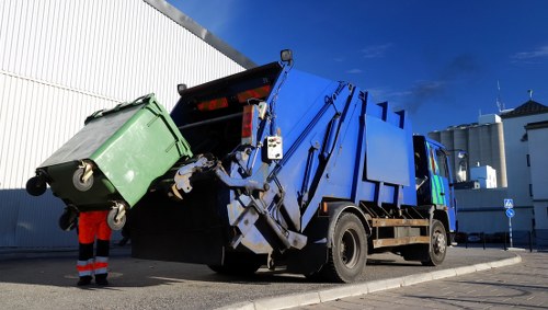 Cluttered garage being professionally cleared in Sudbury